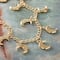 12 Packs: 9 ct. (108 total) Gold Metal Moon Charms, 16mm by Bead Landing™